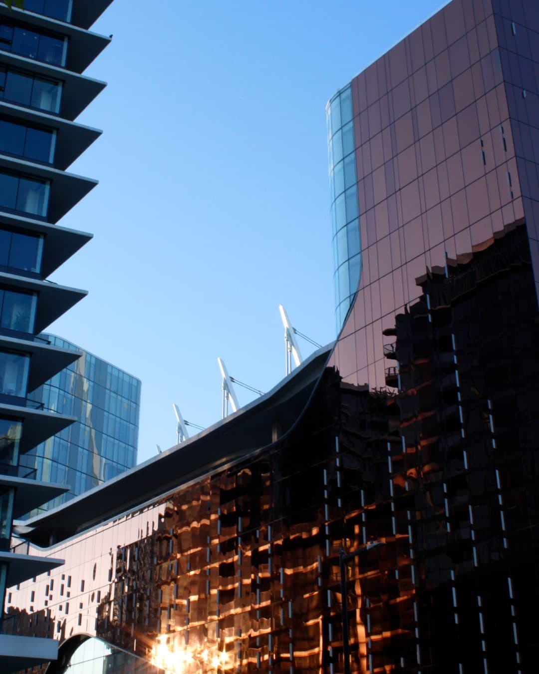 A glass tower reflecting the sunset